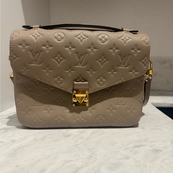 Louis Vuitton Handbags - Louis Vuitton Taupe Embossed Monogram Metis Crossbody with Gold Hardware